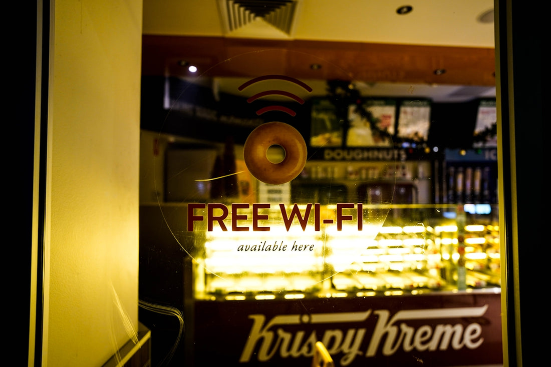 a donut shop with a free wifi sign in the window